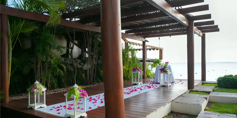 Oceanfront gazebo wedding ceremony setup with floral décor at Zoëtry Villa Rolandi Isla Mujeres